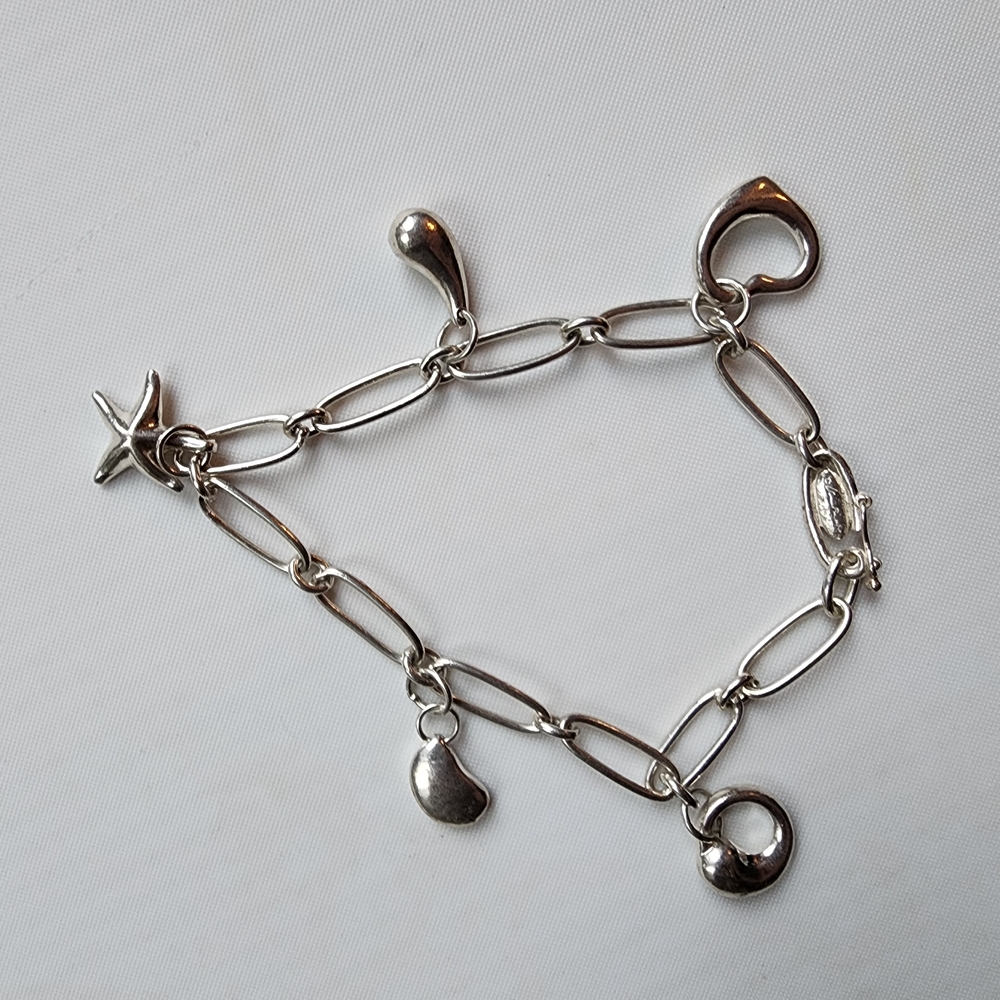 Tiffany & Co. Silver Charm Link Bracelet with Heart and Star Charms